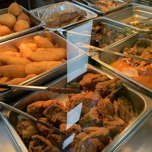 Fried Dumpling, Jerk Chicken, fritters, festival, Calaloo and Saltfish Ackee and Saltfish all in one picture.