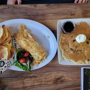 Sourdough hammy , hash browns, and chocolate chip pancakes