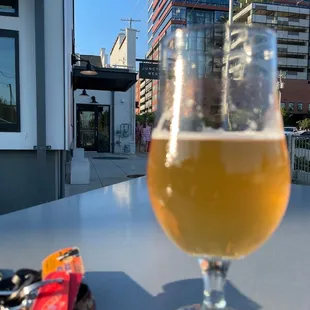 a glass of beer on a table