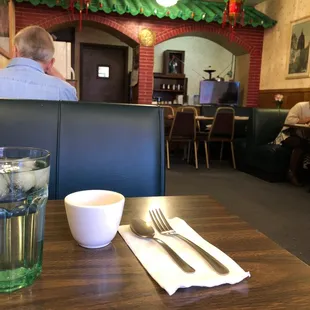 a table with a glass of water on it