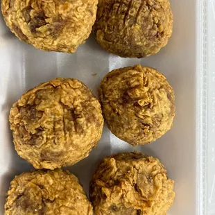 six meatballs in a styrofoam container