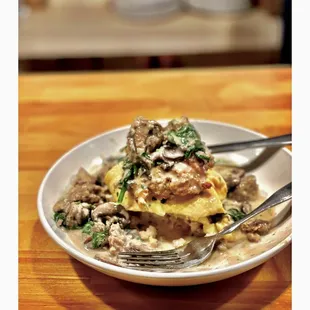 a plate of food on a wooden table