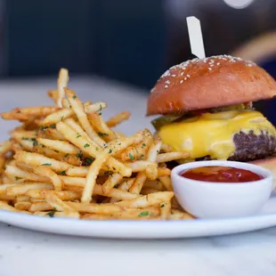 a cheeseburger and fries on a plate