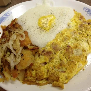 Bacon omelette with home fries grits