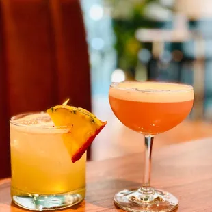 two cocktails on a table