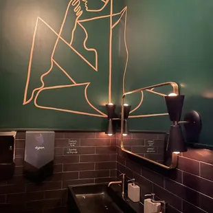 a bathroom with a green wall