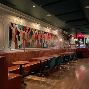 a restaurant with booths and tables