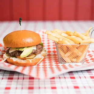 Avocado cheeseburger with fries