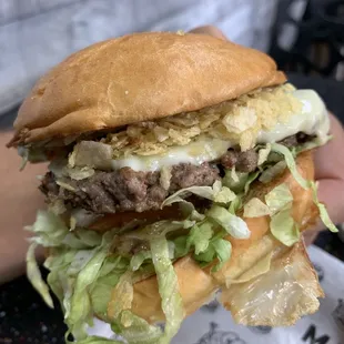 a closeup of a large hamburger