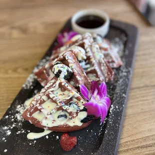 BELGIAN WAFFLE -traditional served with maple syrup 12 Add red velvet birthday cake 4, banana split 4, berries or bananas 4