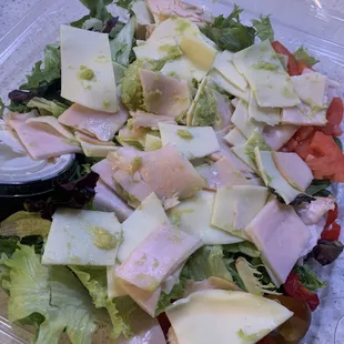 a salad in a plastic container