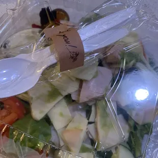 a salad in a plastic container