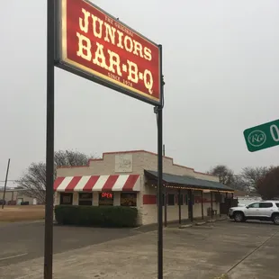 a sign in front of a restaurant