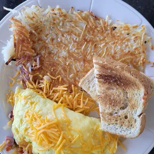 Everything Omelet with hash browns and sourdough toast.