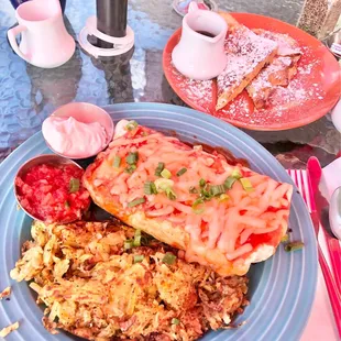 Burrito with tofu and vegan sausage, with hand shredded hash browns.
