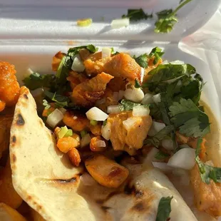 a meal in a styrofoam container