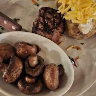 Filet mignon, loaded baked potato and mushrooms.