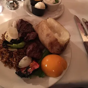 Beef steak kebab rice baked potato and a peach