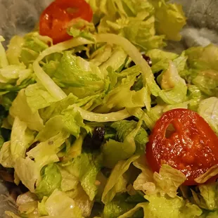 a salad with tomatoes and lettuce
