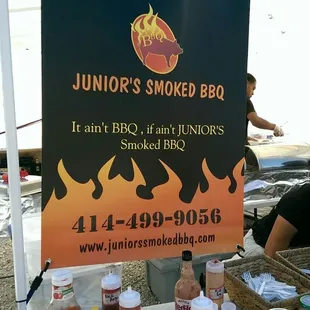 a sign for junior&apos;s smoked bbq