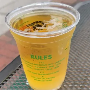 a cup of beer on a table