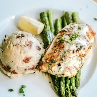 Lemon tarragon, stuffed chicken breast. goat cheese, roasted red pepper, fresh basil with lemon tarragon, cream sauce