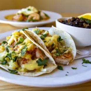 Citrus shrimp tacos with coconut rice and citrus black beans