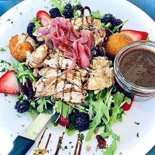 Forsyth Fig Salad: sweet tea brined grilled chicken, honey-rosemary goat cheese fritters, red onion marmalade, fresh berries, fig balsamic