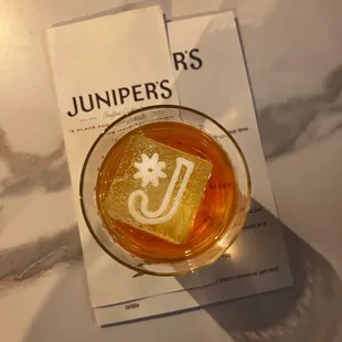 a drink in a glass on a table