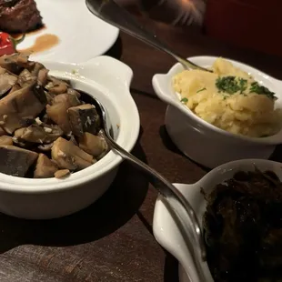 Sautéed mushrooms in wine sauce, mashed potatoes, balsamic vinegar and bacon Brussels sprouts are the sides we chose.