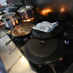 a person cooking food on the stove