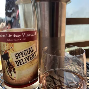 a glass of wine and a bottle of wine