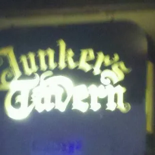 a neon sign for junker's tavern