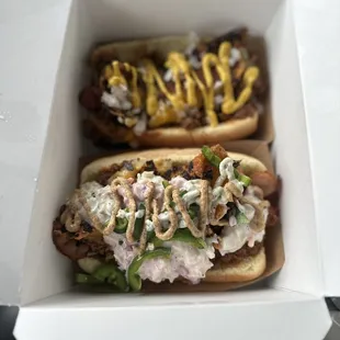 two hot dogs in a box