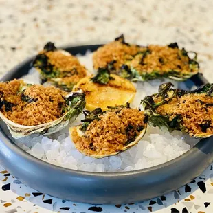 Juno &amp; the Peacock &quot;Oysters Rockefeller&quot; Pernod, Creamed spinach. NO BACON. Topped w/breadcrumbs.
