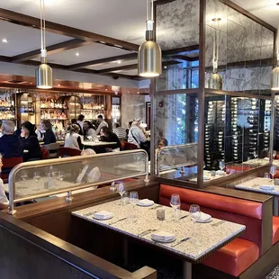 Their active bar with dining and wine wall backdrop