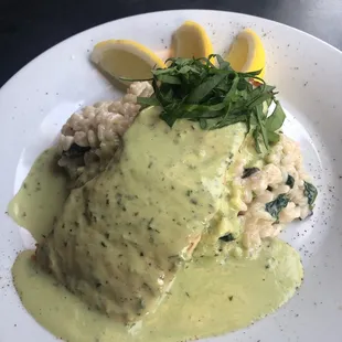 Salmon with avocado crema over risotto.