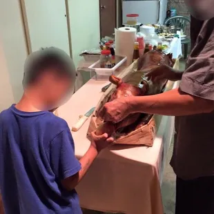 a man and a young boy in a kitchen