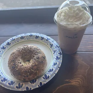 Everything bagel toasted with cream cheese and an iced mocha with whipped cream.