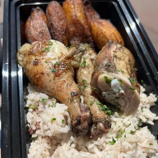 a tray of rice and meat