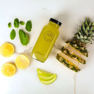 a pineapple, lemons, and a pineapple juice