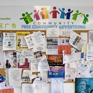 a bulletin board covered in advertisements