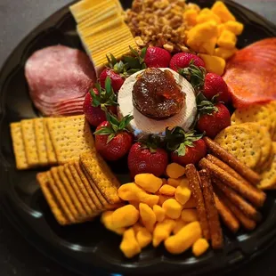 a platter of cheese and crackers