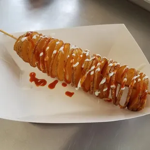 Our Potato Tornado, shown topped with Ranch and Tapatio