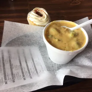 Broccoli cheddar soup and a strawberry shortcake cupcake