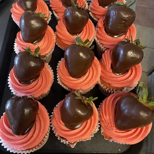 Chocolate dipped strawberries on chocolate cupcakes