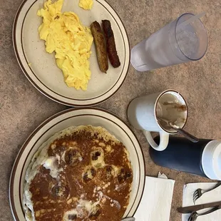Banana Pancakes, Two Eggs Scramble, Sausage Links and the best hot chocolate I&apos;ve had in the USA!