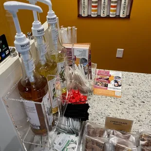 a counter with a variety of condiments