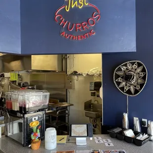 a counter with a sign above it