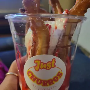Super yummy churro a la mode with strawberry sauce.